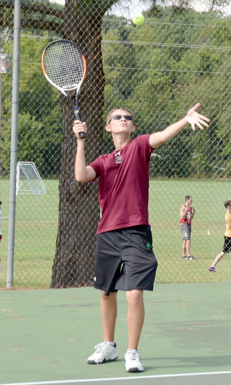 Graham Thomas/Siloam Sunday Siloam Springs senior Chad Hall prepares to serve in his tennis match on Thursday against Bryce George of Shiloh Christian. Hall defeated George 8-0.