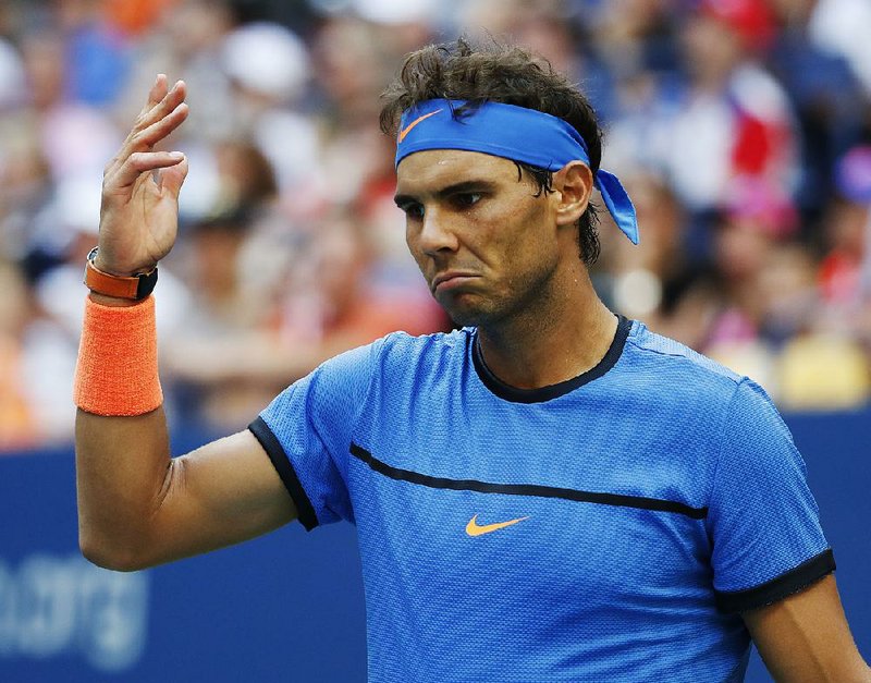 Rafael Nadal, of Spain, gestures during play with Lucas Pouille, of France, during the fourth round of the U.S. Open tennis tournament, Sunday, Sept. 4, 2016, in New York. 