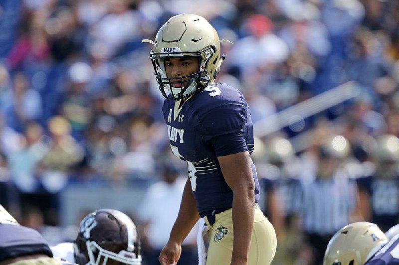 Navy quarterback Malcolm Perry took the phrase “call of duty” to new heights when he was called out of the
stands during the third quarter of Saturday’s game against Fordham and asked to suit up.