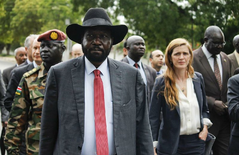 South Sudanese President Salva Kiir (front) takes representatives of the U.N. Security Council, including U.S. Ambassador Samantha Power, on a tour Sunday outside the presidential compound in Juba.