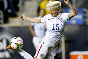 FILE - In this Oct. 24, 2014, file photo, United States midfielder Megan Rapinoe (15) against Mexico in the second half during a CONCACAF semifinal soccer match in Chester, Pa. Five players from the World Cup-winning U.S. national team have accused the U.S. Soccer Federation of wage discrimination in an action filed with the Equal Employment Opportunity Commission. Alex Morgan, Carli Lloyd, Megan Rapinoe, Becky Sauerbrunn and Hope Solo maintain in the EEOC filing they were payed nearly four times less than their male counterparts on the U.S. men's national team. The filing was announced in a press release on Thursday, March 31, 2016. (AP Photo/Rich Schultz, File)