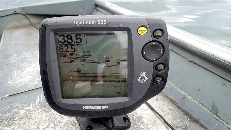 A depth finder is key to catching fish with jigging spoons in summer and fall. The screen here shows schools of threadfin shad as well as game fish at various depths. Once fish are located, lower a jigging spoon over the side of the boat and let it hit bottom. Crank the reel a couple of turns and jig the spoon up and down with the rod tip. Raise it with a quick snap of the rod tip and let it sink on a tight line.