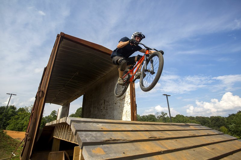 Josh Woodmancy of Rogers rides the course on Wednesday at the Railyard. The mountain bike course is approaching its one-year anniversary.