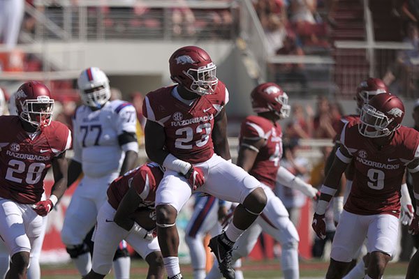 Arkansas linebacker Dre Greenlaw (23) celebrates after intercepting a pass during the second quarter of a game against Louisiana Tech on Saturday, Sept. 3, 2016, in Fayetteville. 