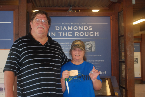 Thomas and Deborah Miller pose for a photo after finding at 1.05-carat diamond at Crater of Diamonds State Park Monday.
