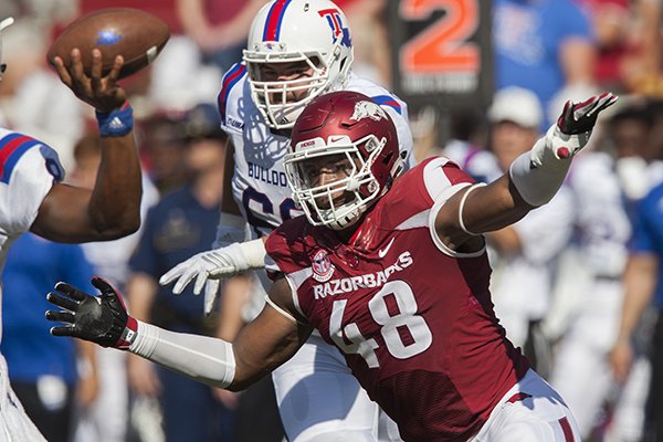 Arkansas defensive end Deatrich Wise rushes Louisiana Tech quarterback J'mar Smith during a game Saturday, Sept. 3, 2016, in Fayetteville. 