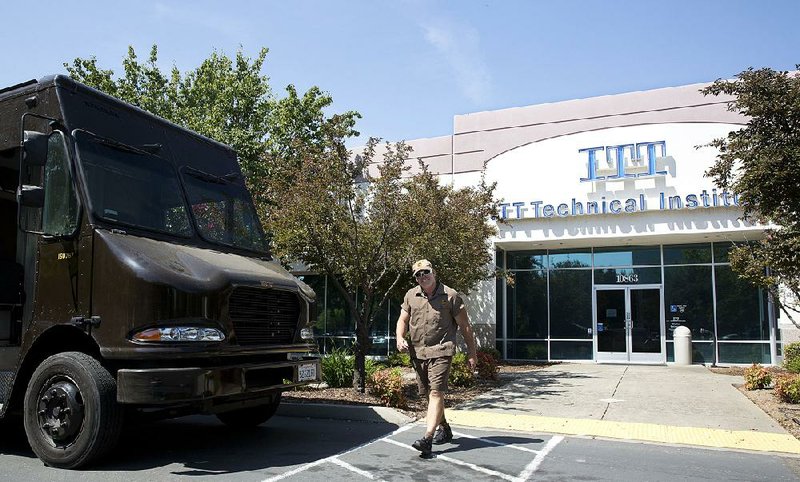 United Parcel Service driver Casey Corrigan, who was at ITT Technical Institute’s Rancho Cordova, Calif., campus to check for packages to pick up, leaves Tuesday after finding the doors locked. 