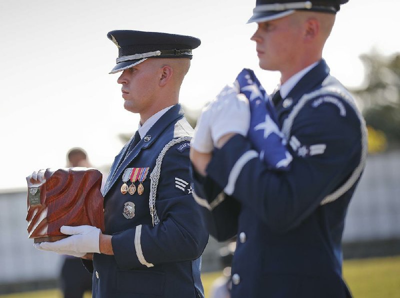 Air Force Honor Guard members carry the remains of World War II pilot Elaine Danforth Harmon during burial services Wednesday at Arlington National Cemetery in Arlington, Va.