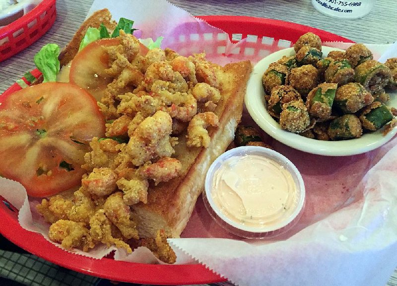 An ample crawfish po’ boy is served with one side (pictured here is fried okra) at Soul Fish Cafe in Little Rock. 
