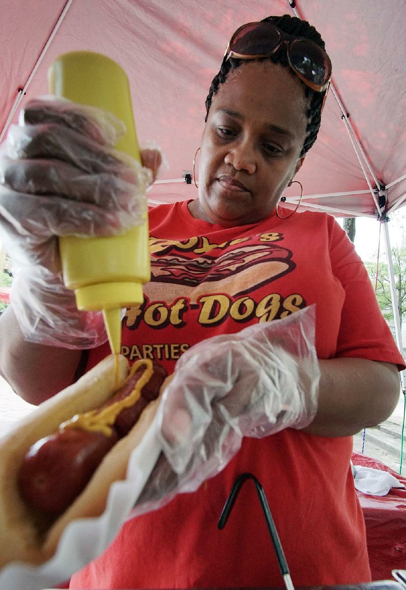 Roxie Pumphrey and Roxie’s Hot Dogs of Jacksonville were among the Main Street Food Truck Fridays mobile food vendors Friday. The Downtown Little Rock Partnership’s weekly event will run up to the Sept. 24 Main Street Food Truck Festival and beyond — through Oct. 28. 