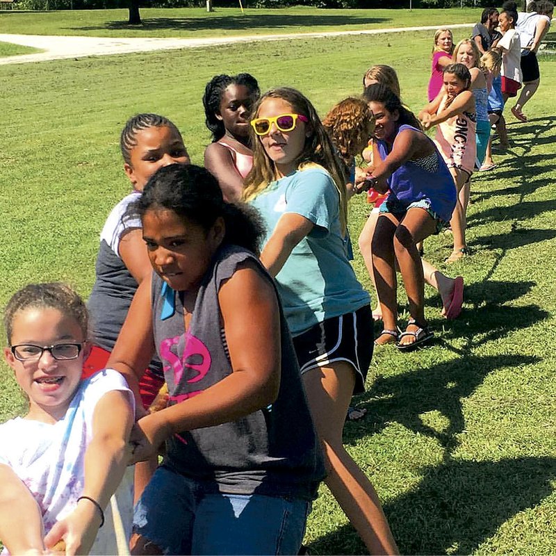 Girls play tug-of-war at the Girls Inc. of Fort Smith’s summer camp in July. The Fest of Ale benefit Saturday will support offerings that include an after-school program, summer camps and outreach initiatives.