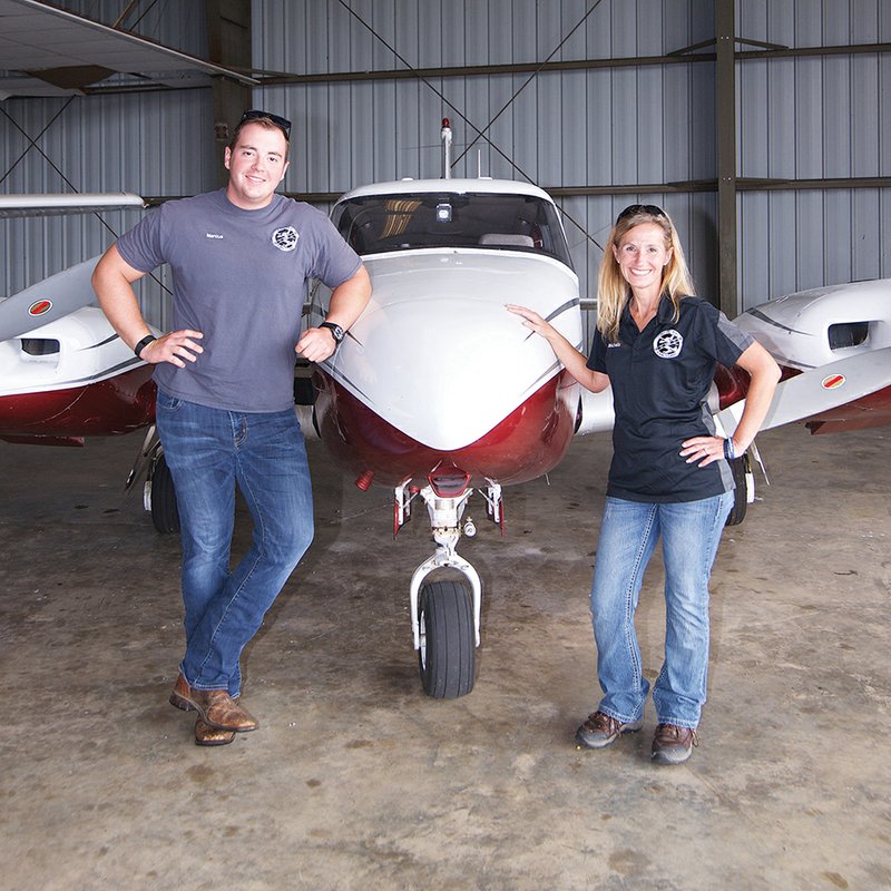 Arkadelphia Municipal Airport manager Michelle Anthony, right, is joined by Marcus Caldwell, left, a recent graduate of Henderson State University’s aviation program, in the day-to-day operations of the airport.