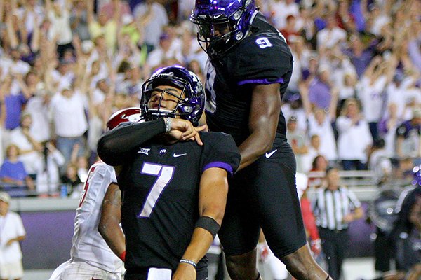 TCU quarterback Kenny Hill (7) gives a throat-slash gesture after scoring a touchdown in the fourth quarter of a game against Arkansas on Saturday, Sept. 10, 2016, in Fort Worth, Texas. 
