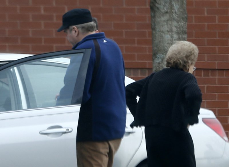 In this March 19, 2015 file photo, John Hinckley Jr., left, gets into his mother's car in front of a recreation center in Williamsburg, Va. 