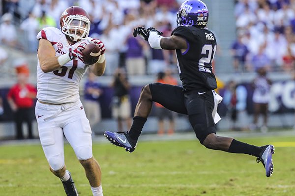 Arkansas linebacker Brooks Ellis intercepts a pass and returns it for a touchdown during a game against TCU on Saturday, Sept. 10, 2016, in Fort Worth, Texas. 