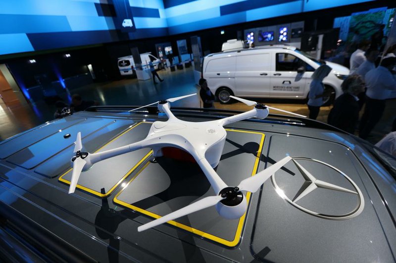 A delivery drone, developed by Matternet, sits mounted on a roof panel of a new Mercedes-Benz Vision van, manufactured by Daimler AG, in Stuttgart, Germany, last week.