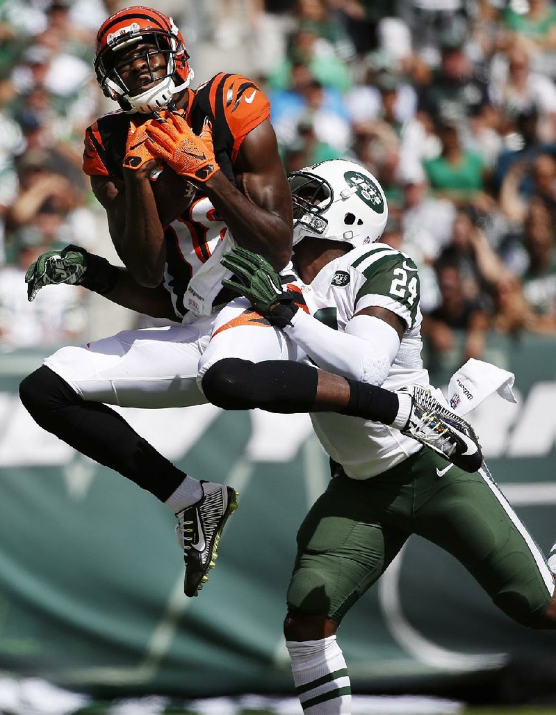 Cincinnati Bengals receiver A.J. Green caught 12 passes for 180 yards and a touchdown in Sunday’s 23-22 victory over the New York Jets in East Rutherford, N.J.