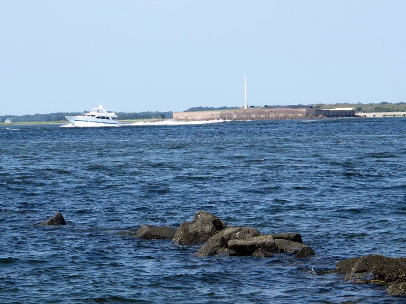 A pleasure boat motors past Fort Sumter in this Friday, Sept. 9, 2016, photograph taken from the beach on Sullivans Island, S.C. U.S. Sen. Tim Scott, R-S.C., has introduced a bill in the Senate to designate Fort Sumter, which is in Charleston Harbor, and Fort Moultrie, on Sullivans Island, as a national park, raising the status of the sites in a move that is expected to attract more visitors. Fort Sumter is where the opening shots of the Civil War were fired in 1861. 