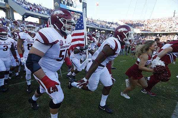 Arkansas players run onto the field prior to a game against TCU on Saturday, Sept. 10, 2016, at Amon G. Carter Stadium in Fort Worth, Texas. 