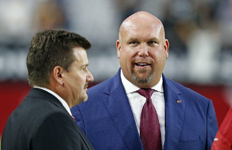 Arizona Cardinals General Manager Steve Keim (right) was even less happy with the team’s loss to New England
when he woke up Monday morning.