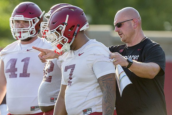 Briston Guidry, freshman defensive lineman, and defensive line coach Rory Segrest
Arkansas football practice on Thursday, Aug. 4, 2016, at the University of Arkansas in Fayetteville.