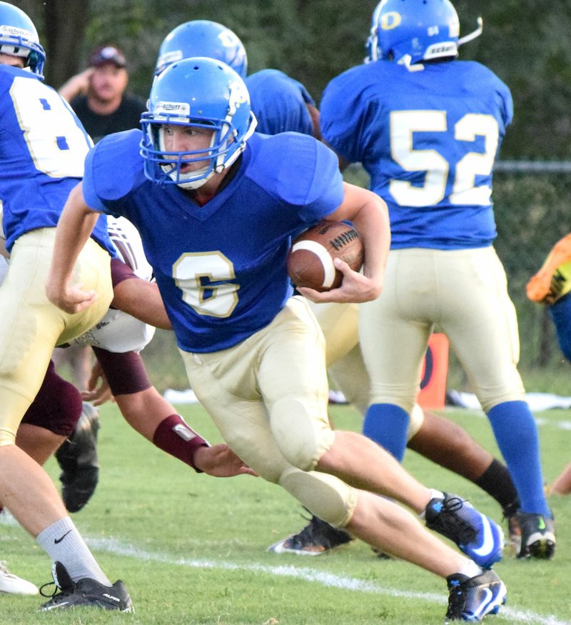 Photo by Mike Eckels Decatur&#8217;s Troy Kell (6) finds an opening in the Pioneer defensive line in an attempt to get to the end zone. Kell was part of the Decatur-Gentry nonconference football game at Bulldog Stadium in Decatur Sept. 9.