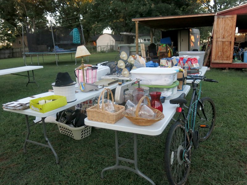 Photo by Susan Holland A burrito fundraiser and huge yard sale is being held this Saturday and Sunday for Darrin and Kimberly Carnahan of Gravette. Many of the sale items are shown in this photo. Proceeds will go to help pay for Darrin&#8217;s cancer treatment bills and his upcoming funeral expenses. All donations of sale merchandise will be appreciated.