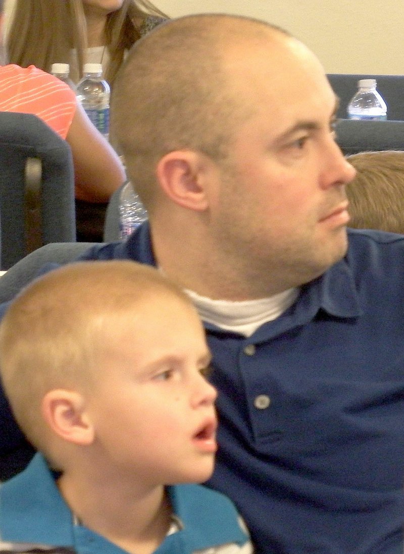 Police officer Michael Lisenbee and his son, Maxwell, 5, were among those honored Saturday.