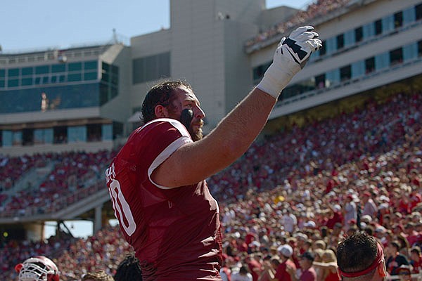 Arkansas offensive lineman Dan Skipper motions to the crowd during a game against Louisiana Tech on Saturday, Sept. 3, 2016, in Fayetteville. 