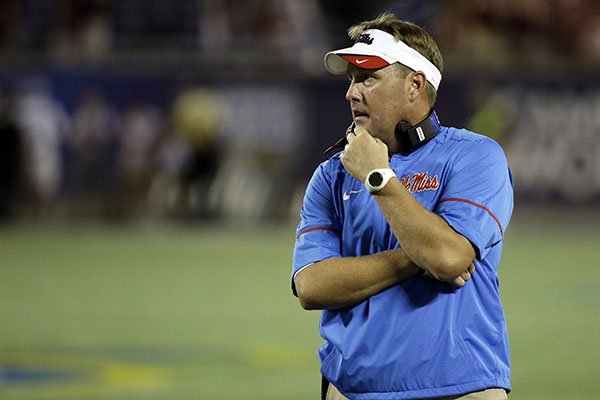 Mississippi head coach Hugh Freeze has a moment to himself during a timeout during the first half of an NCAA college football game against Florida State, Monday, Sept. 5, 2016, in Orlando, Fla. (AP Photo/John Raoux)

