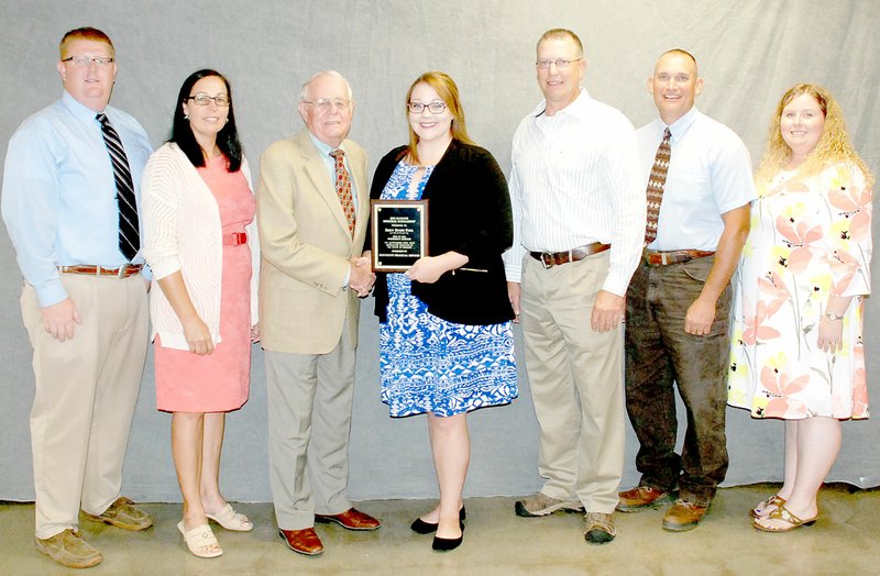 SUBMITTED PHOTO Emily Paul, a 2011 McDonald County High School graduate, was recognized as the top new agriculture education teacher in Missouri. Pictured are, from left, Jack Green, Cindy Schuknecht, Bill Northcutt, Paul, Doyle Justus, Jayson Shriver and Tiffany Kauffman.