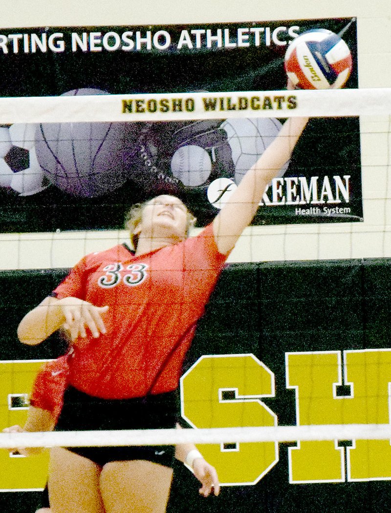 Photo by Rick Peck McDonald County&#8217;s Lindsey Limore stretches for a ball during the Lady Mustangs 25-11, 25-5 win over Neosho on Sept. 6 at Neosho High School.