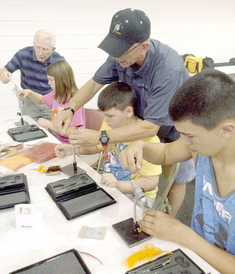 Photo submitted The Clarkson siblings, of Anderson, enjoyed some family time together at the recent Young Outdoorsmen United Fly-Tying event held in Pineville. Area youth created their own fishing flies and learned how to cast a fly rod.