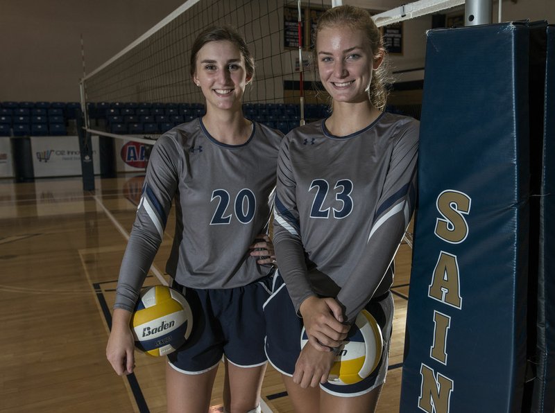 Lexi Richards (20) and Haley Richards (23) stand Friday at Shiloh Christian in Springdale. They are the third and fourth of the Richards sisters who have excelled at volleyball at Shiloh Christian.