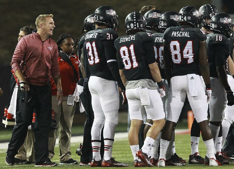 Coach Blake Anderson (left) and Arkansas State are 1-9 against nonconference FBS teams, including a 1-4 mark against Group of Five conferences, in Anderson’s three years at the school. The only victory came against tonight’s opponent, Utah State, in 2014.