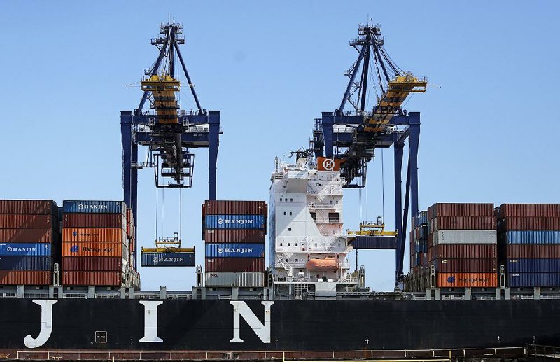 The container ship Hanjin Boston is unloaded at the Port of Los Angeles on Tuesday.