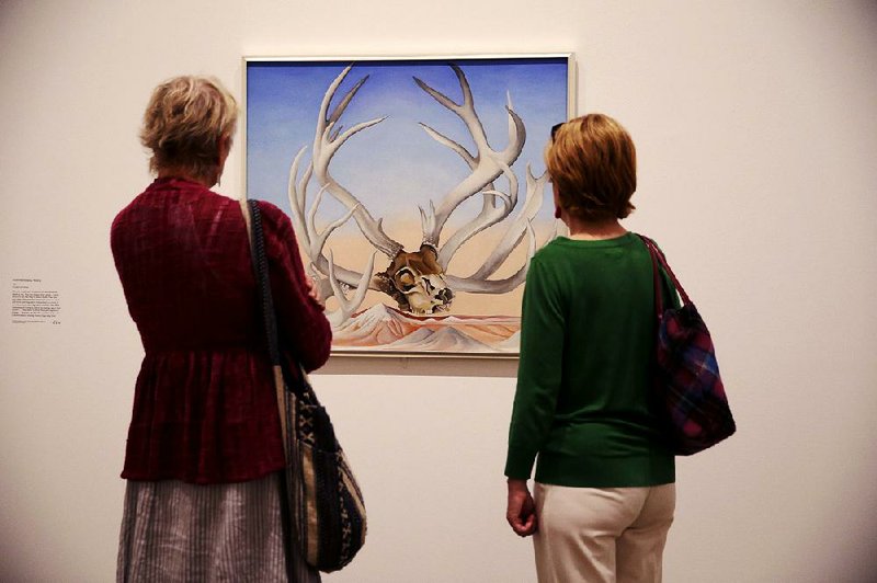 A visitor examines From the Faraway, Nearby by Georgia O’Keeffe. A retrospective exhibition of her works is on display at the Tate Modern in London before moving on to Vienna. 