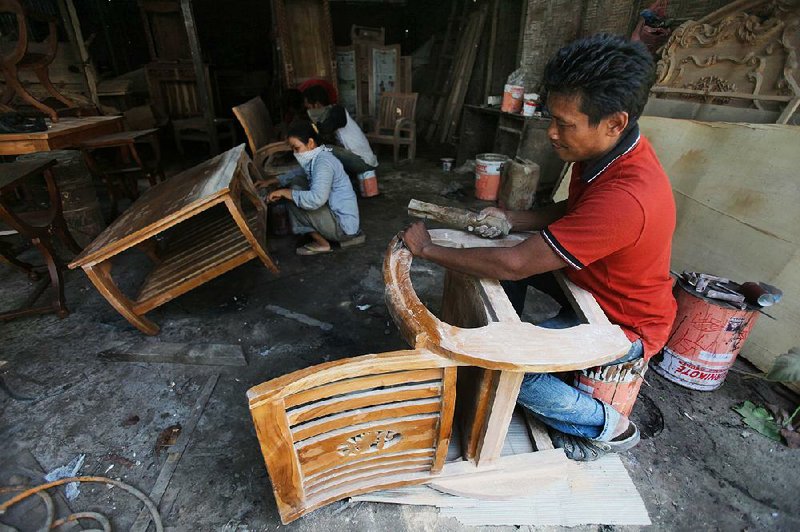 Workers make furniture at a factory in Medan, North Sumatra, Indonesia, earlier this month.