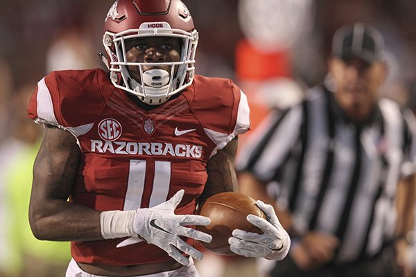 Arkansas cornerback Ryan Pulley scores a touchdown during a game against Texas State on Saturday, Sept. 17, 2016, in Fayetteville.