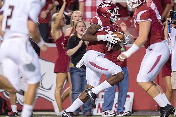 Arkansas cornerback Ryan Pulley scores a touchdown during a game against Texas State on Saturday, Sept. 17, 2016, in Fayetteville. 