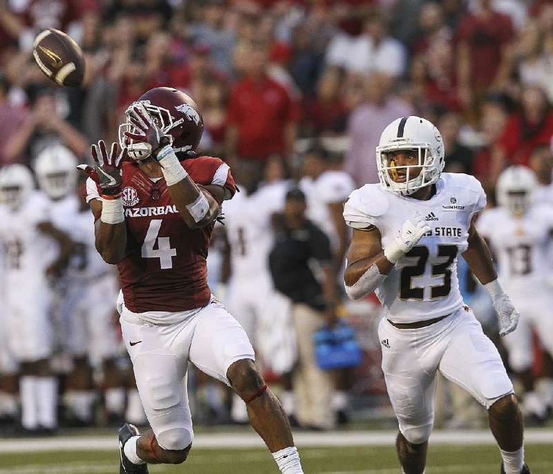 Arkansas Democrat-Gazette/BENJAMIN KRAIN --9/17/2016--
Arkansas Keon Hatcher catches a long pass downfield during the Razorbacks game against Texas State Saturday in Fayetteville.