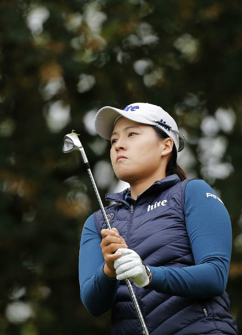 In Gee Chun of South Korea follows the flight of her ball after playing on the 2nd hole during the third round of the Evian Championship women's golf tournament in Evian, eastern France, Saturday, Sept. 17, 2016. 