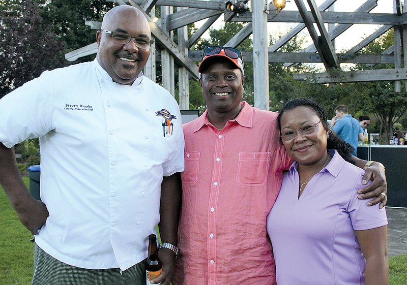 Chef Steven Brooks (from left) talks with Mack and Diane Epps at Chefs in the Garden.