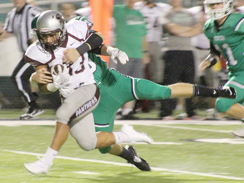 George &quot;Clay&quot; Mitchell/Special to Siloam Sunday Van Buren&#8217;s Ranze McDonnor tries to bring down Siloam Springs&#8217; Kevin Canales during the first quarter at Citizens Bank Stadium at Blakemore Field on Friday.