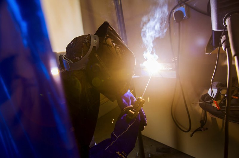 Mirielle Still, Gravette High School senior, works Thursday in the welding class led by Northwest Technical Institute instructor Brian Wheeler at Gravette. Still says she gets satisfaction from “showing up all the boys.” Thirteen students from Gravette, Decatur and Bentonville high schools are participating in the new class.