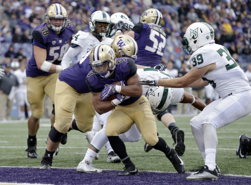 Washington Myles Gaskin runs in for a touchdown with Portland State safety Beau Duronslet (39) defending in the first half of an NCAA college football game, Saturday, Sept. 17, 2016, in Seattle. 