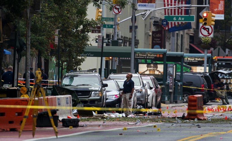 Crime scene investigators work at the scene of Saturday's explosion in Manhattan's Chelsea neighborhood, in New York on Sunday.