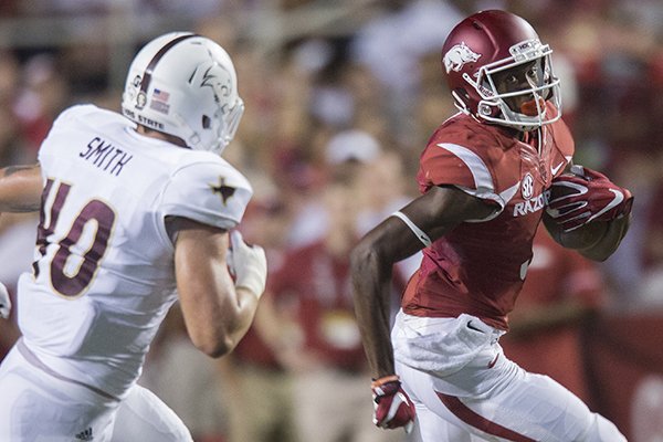 Arkansas receiver Dominique Reed runs during a game against Texas State on Saturday, Sept. 17, 2016, in Fayetteville.