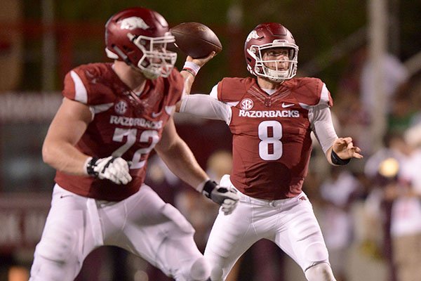 Arkansas quarterback Austin Allen throws a pass as Frank Ragnow protects during a game against Texas State on Saturday, Sept. 17, 2016, in Fayetteville. 