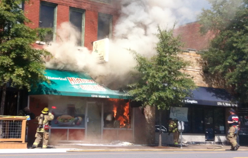 Smoke is visible coming from Midtown Billiards Monday morning.